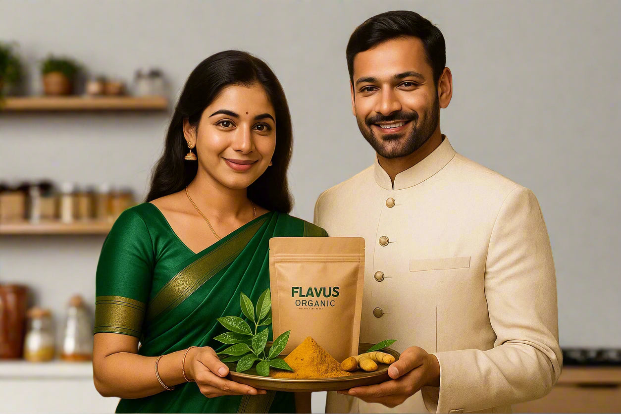Man and woman holding a bag of Flavus Organic curry powder in a kitchen setting.